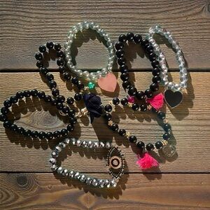 Set of Beaded Bracelets with Charms